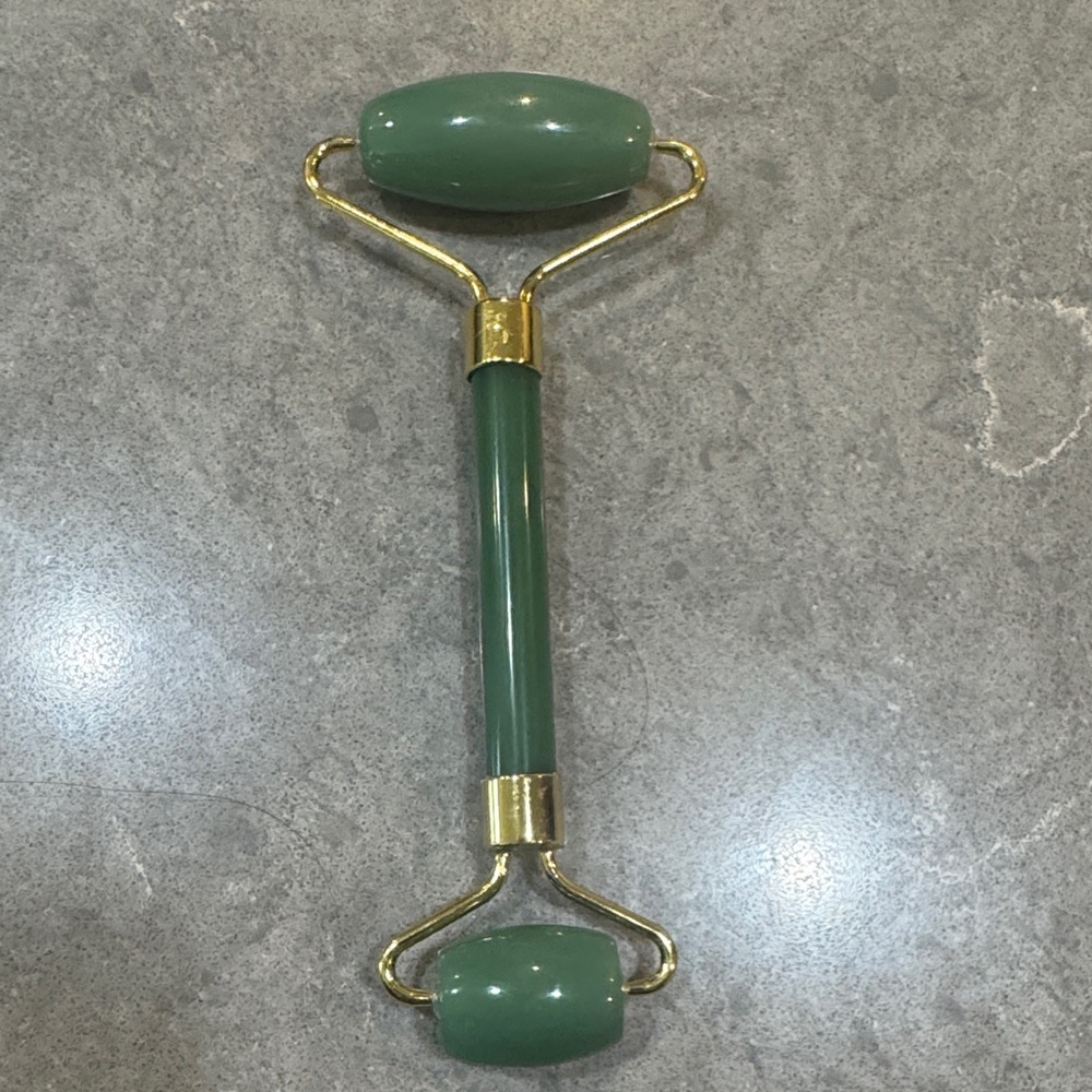 Green Facial Roller with Gold Accents